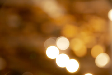Gold abstract bokeh background and glitter bokeh lights. image is blurred and filtered.