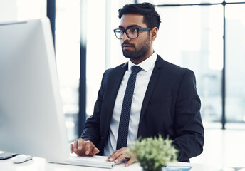 Fototapeta premium Computer, research and reading with business man in office for investor portfolio, equity planning or risk management. Online, consultant and website with person in corporate company for admin report