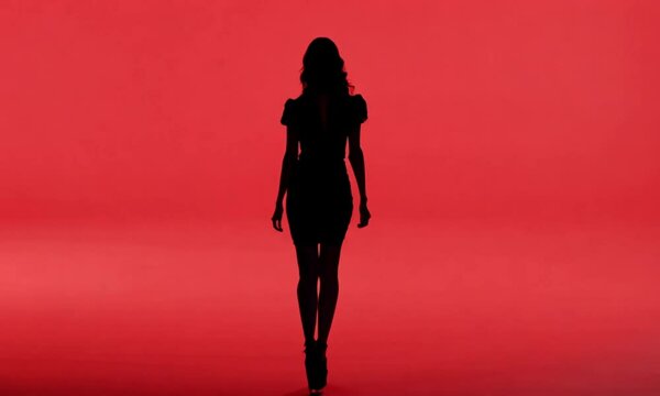 silhouette of a woman on red background