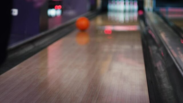 boy learning to bowl, unsuccessful attempt to throw ponglyam ball, child playing bowling in recreational sports center