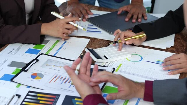 Group of business people brainstorming in analytical plan meeting Calculate the numbers obtained from the graph. Financial growth chart. Marketing. Concept of business success statistics.