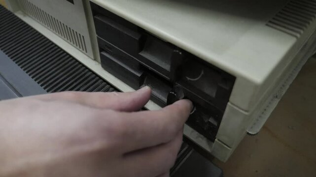 The Inserting Old-style 5.25 Inch Floppy Disk. Old Pc Look
