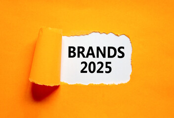 Planning brands 2025 new year symbol. Concept words Brands 2025 on beautiful white paper. Beautiful orange paper background. Business brands 2025 new year concept. Copy space.
