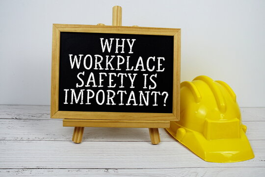 Why Workplace Safety Is Important? text on blackboard with safety helmet on wooden background