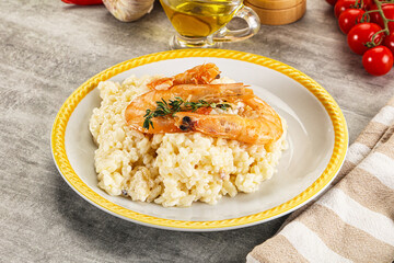 Italian risotto with prawn served thyme