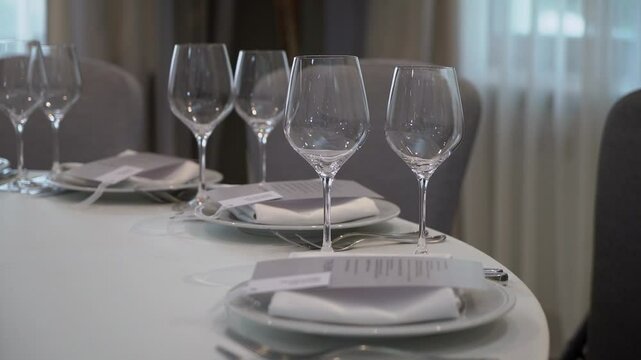 A beautifully set dining table with exquisite glassware and elegant cutlery for a delightful meal experience