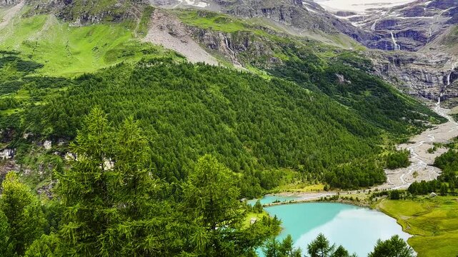 Beautiful Panoramic View over Alpine Lake Pal&uuml; and Alp Gr&uuml;m with Glacier and Mountain View and valley in a Sunny Summer Day in Poschiavo, Bernina, Grisons, Switzerland.