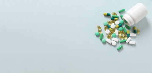 Various medical pills with botlle on a colored background