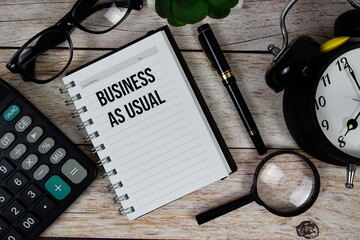 Business as Usual (BAU) text on notepad, Business and Financial concept background