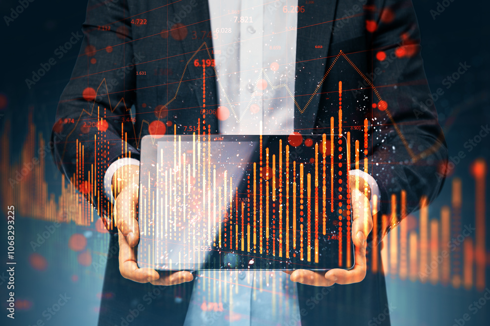 Poster close up of businessman hand using pad with falling red candlestick forex chart on blurry background