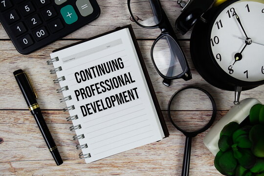 Continuing Professional Development (CPD) text on notepad, Business and Financial concept background