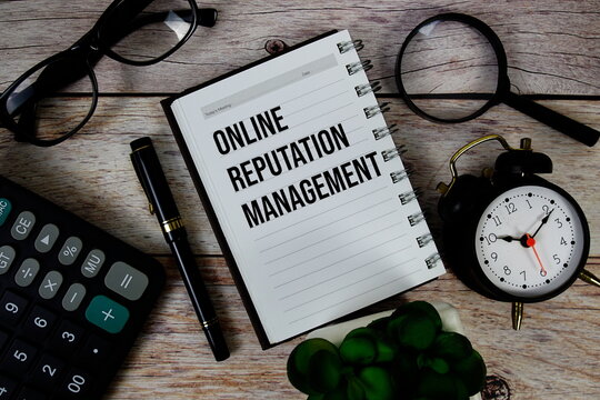 Online Reputation Management (ORM) text on notepad, Business and Financial concept background