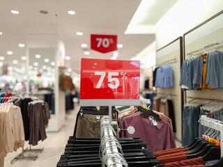 Obraz premium selective focus to red discount board with 75% writing. for discount templates for women's and men's clothing at the mall. soft focus