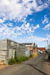 Heritage shacks that cannot be changed, but are facades for accommodation that looks much nicer on the other side of the shack, in Broken Hill, a mining town past its mining heyday, in Australia.