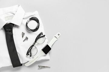 Stylish men's clothes and accessories on grey background