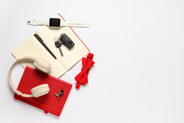 Stylish men's accessories with notebooks and modern headphones on white background