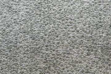 ぼこぼこ、ざらざらの発砲スチロールの表面　テクスチャー背景素材壁紙　粒粒の質感のアップ