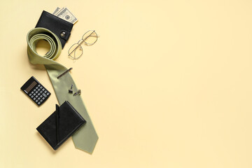 Stylish men's accessories on yellow background