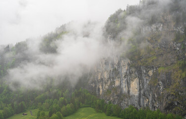 Fototapeta premium Lauterbrunnen, Village in Switzerland, in the Swiss Alps, Beautiful Valley with rocky cliffs and Waterfalls, Known as the Land of 72 Waterfalls