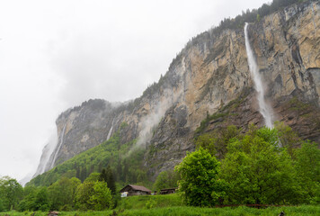 Lauterbrunnen, Village in Switzerland, in the Swiss Alps, Beautiful Valley with rocky cliffs and...