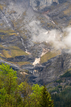 Grindelwald village located in Switzerland&rsquo;s Bernese Alps, Eiger Mountain, Gletscherschlucht, waterfalls and striated limestone walls