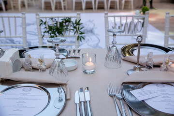 Outdoor Wedding Reception Setup with Elegant Tables and Floral Centerpieces