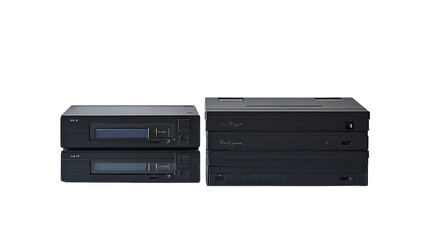 Fototapeta premium Stack of vintage audio equipment with sleek black design, showcasing classic sound technology and appeal for audiophiles and collectors.