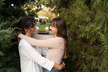 Fototapeta premium Two girls in a loving couple sharing a tender moment at the park