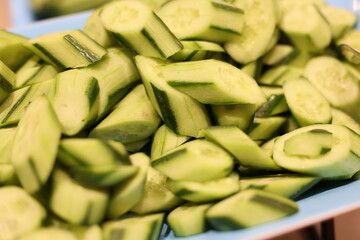 A vibrant display featuring an array of freshly cut cucumbers, perfect for enhancing salads and serving as tasty snacks