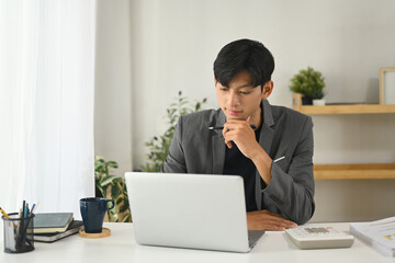 Professional businessman concentrating on work in a modern office