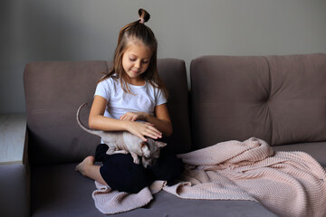 Girl Playing with Sphynx Cats