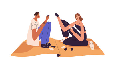 Obraz premium Happy people gambling, play boardgames on blanket. Cute couple spends time together. Friends hold cards in hands, have fun with board games. Flat isolated vector illustration on white background