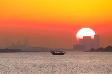 Dhow silhouetted in the sunset