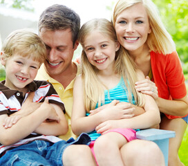 Happy, family and garden with fun, hug and excited outdoor with summer holiday and bonding. Love, support and care of mother, father and children with youth and backyard with smile together at home