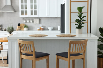 Stylish kitchen with bar stools. Interior design