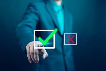 Businessman presents right and wrong icons for decision making yes or no. Concept of displaying right and wrong symbols, decision making, voting, communication of choices and expertise.