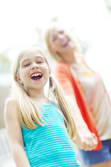 Woman, child and holding hands in garden with love, support or happy with guidance. Portrait, excited girl or mother in home backyard with trust, freedom and family relationship development in Canada