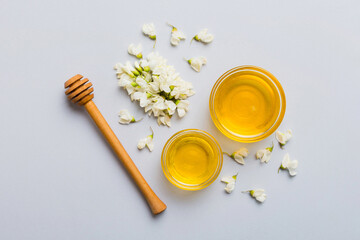 honey jar with acacia flowers and leaves. fresh honey top view flat lay