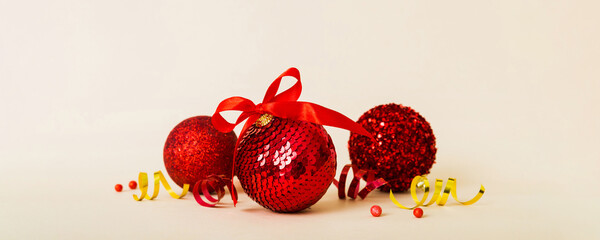 Christmas ball on colored background. decoration bauble with ribbon bow with copy space