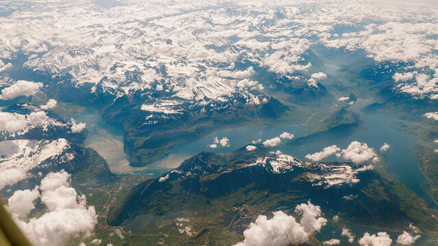 Majestic Aerial View of Snow-Capped Mountains and Serene Lakes