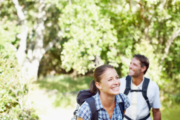 Obraz premium Couple, exercise and happy in nature for hiking, fitness and adventure with bonding, love and support. Man, woman and gear outdoor for challenge, health and trekking with journey, travel and walking