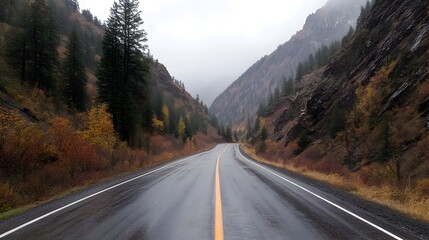 Fototapeta premium A car veering off a winding mountain road caught mid fall before plunging into the treacherous canyon below during a heavy rainstorm and thick fog