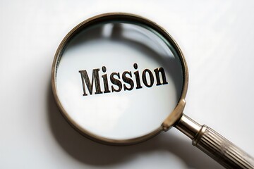 A magnifying glass focuses on the word "Mission," highlighting its importance and clarity in communication.