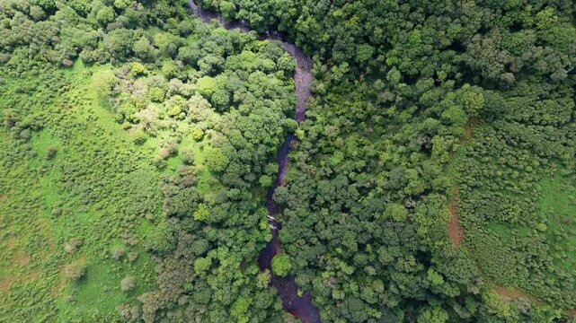 4K Aerial View of Four Waterfalls Walk in Brecon Beacons, Wales, Featuring River and Green Forest