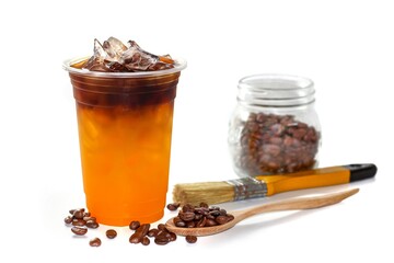 Americano ice coffee serving with coffee beans spread and bottles in white background , concept isolated photo.