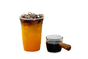 
Orange juice mix with Americano ice coffee serving on white background and isolate photo style.
