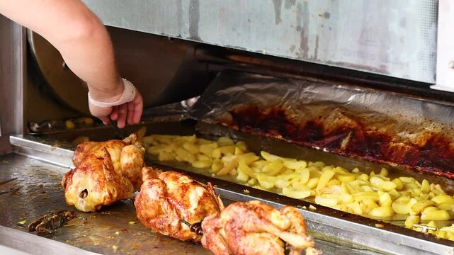 Rotisserie Chicken and Potatoes Cooking