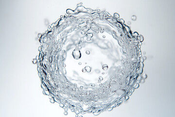 A circle of water droplets with a white background