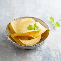 Traditional potato chips in a bowl