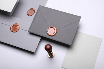 Floating Envelopes with wax seals and cards, vintage stamp on gray background. Gift certificate,...